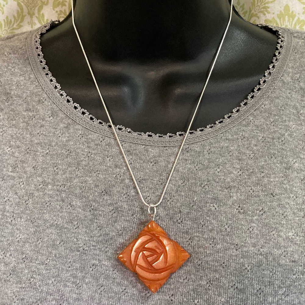Sterling silver necklace with orange stone pendant